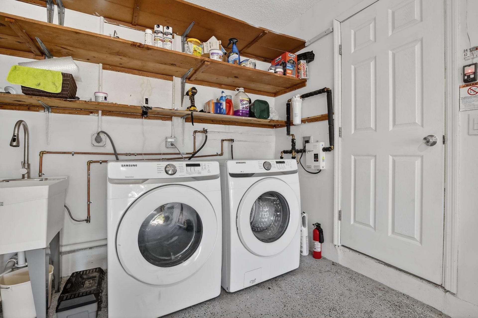 8845 NW 14th Street, Plantation, FL 33322 Laundry is located in the garage