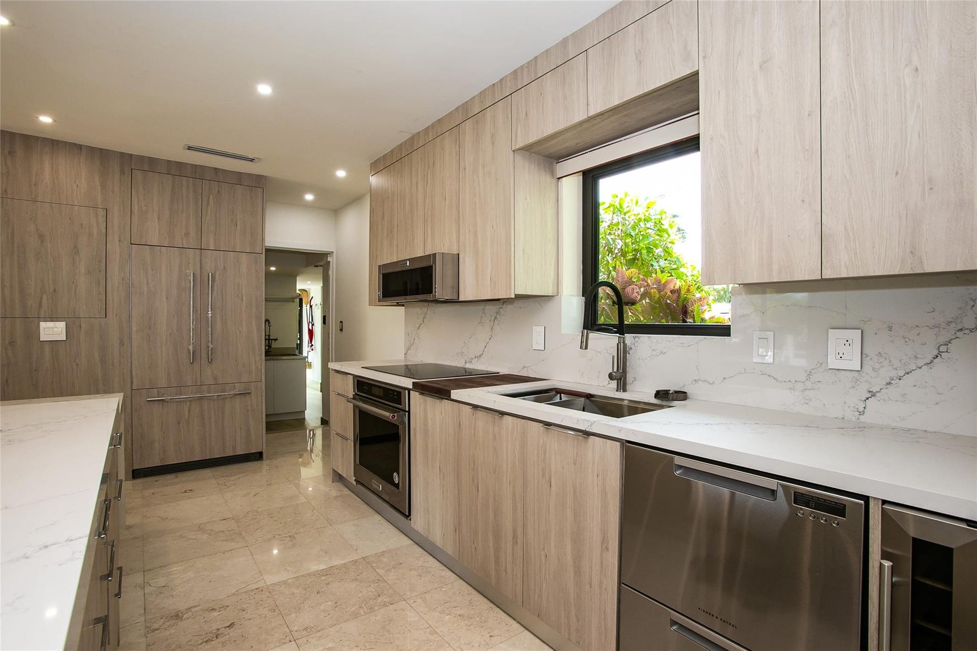 Stunning kitchen with elongated quartz island