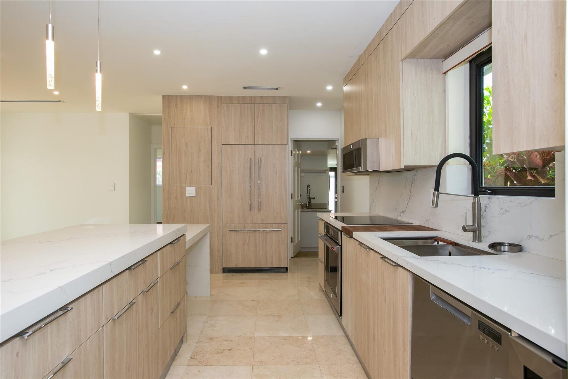 Stunning kitchen with elongated quartz island