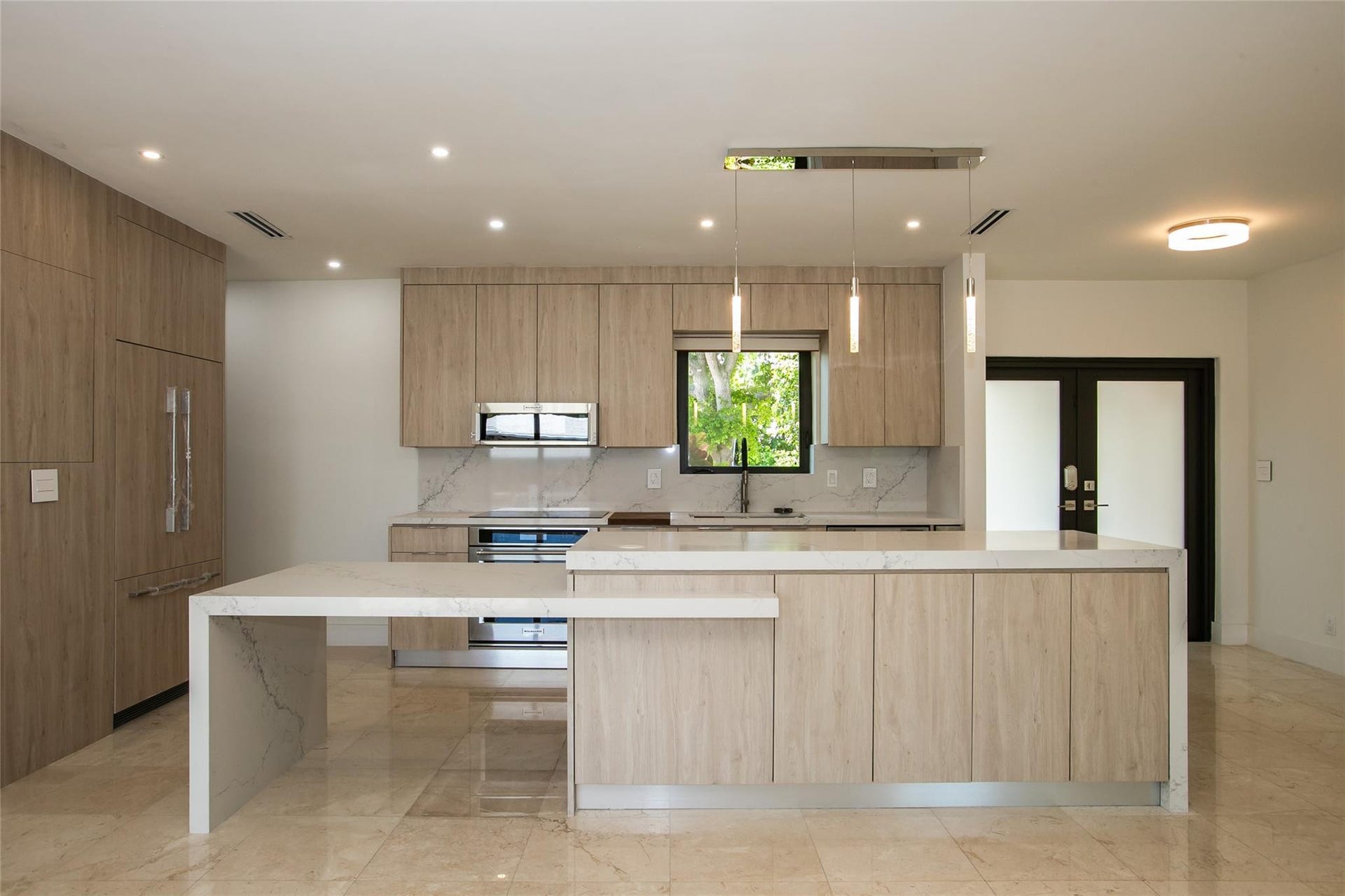 Stunning kitchen with elongated quartz island