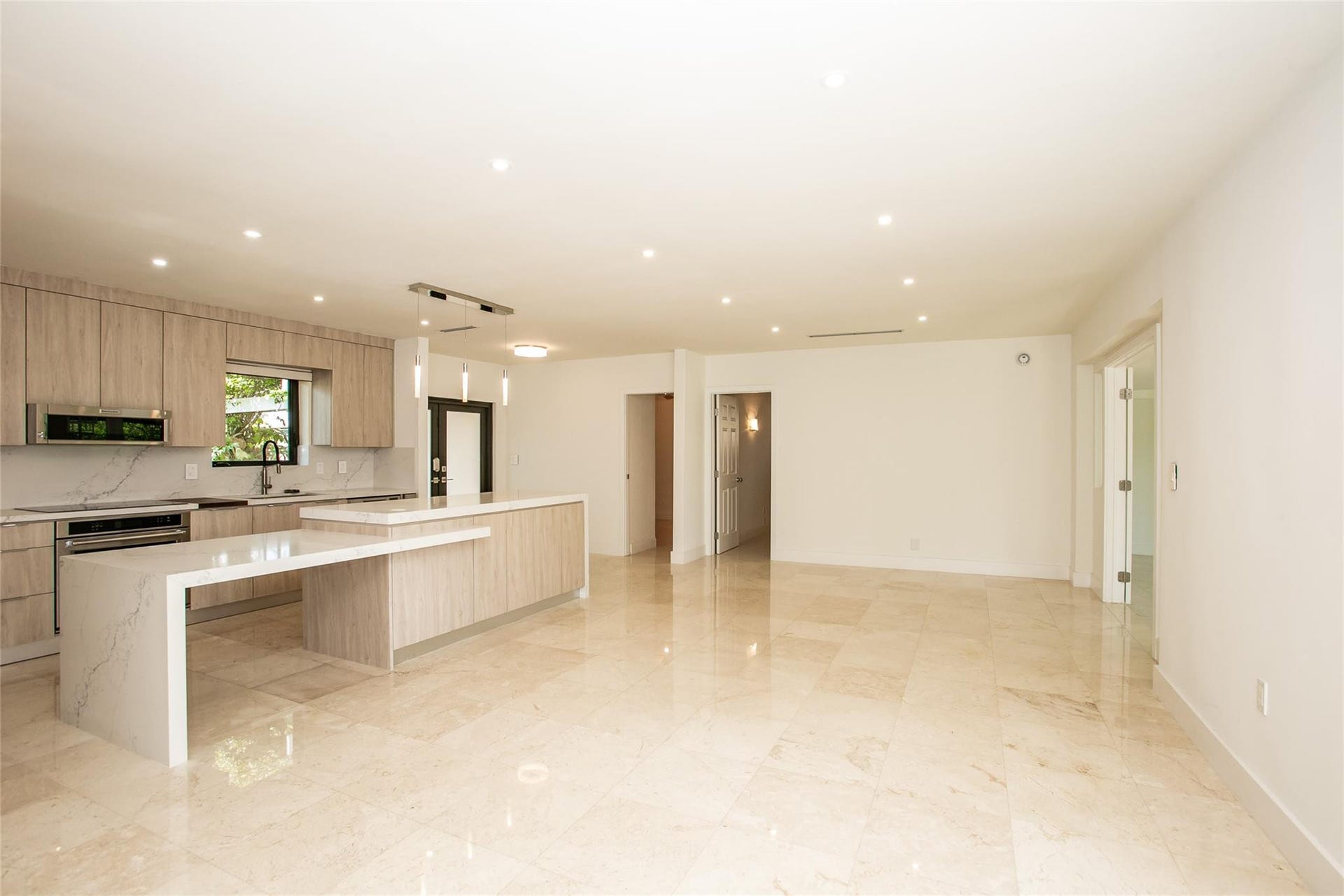 Stunning kitchen with elongated quartz island