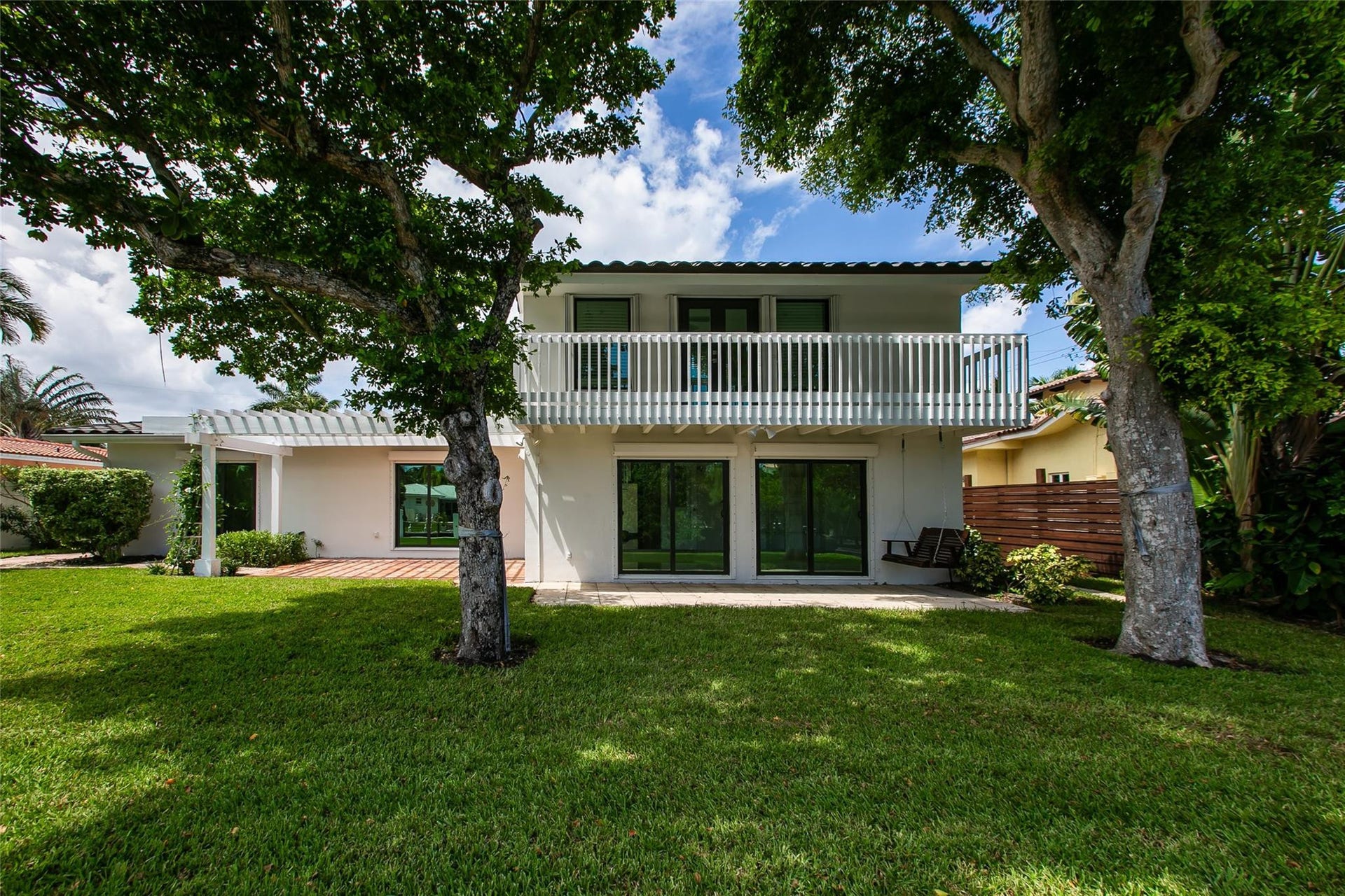 Back Patio and 2nd floor balcony facing Florida Room