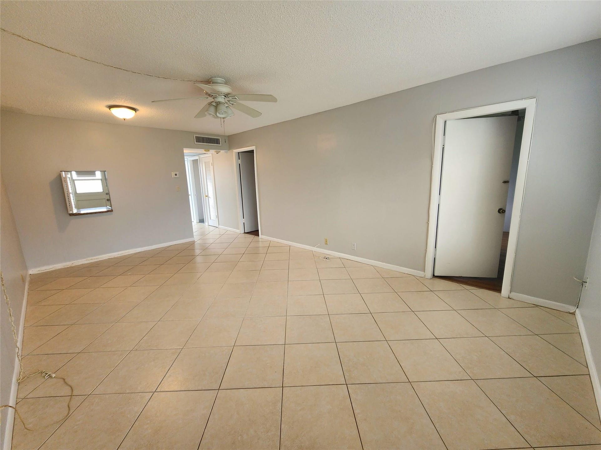 2223 Park Lane, #105, Hollywood, FL 33021 The primary room has easy access to the living and dining areas. This area enjoys oversized neutral ceramic flooring.