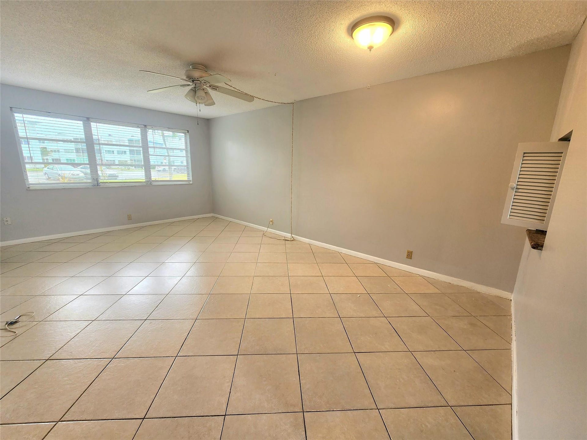 2223 Park Lane, #105, Hollywood, FL 33021 The living dining areas enjoy plenty of natural light from the oversized windows facing the garden area. Pass through to the kitchen makes serving meals super easy.