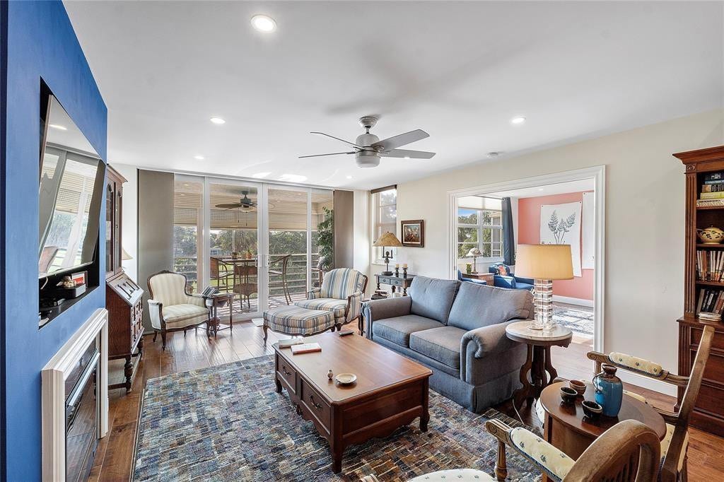 804 Cypress Grove Lane, #407, Pompano Beach, FL 33069 Living room flows onto a screened porch.