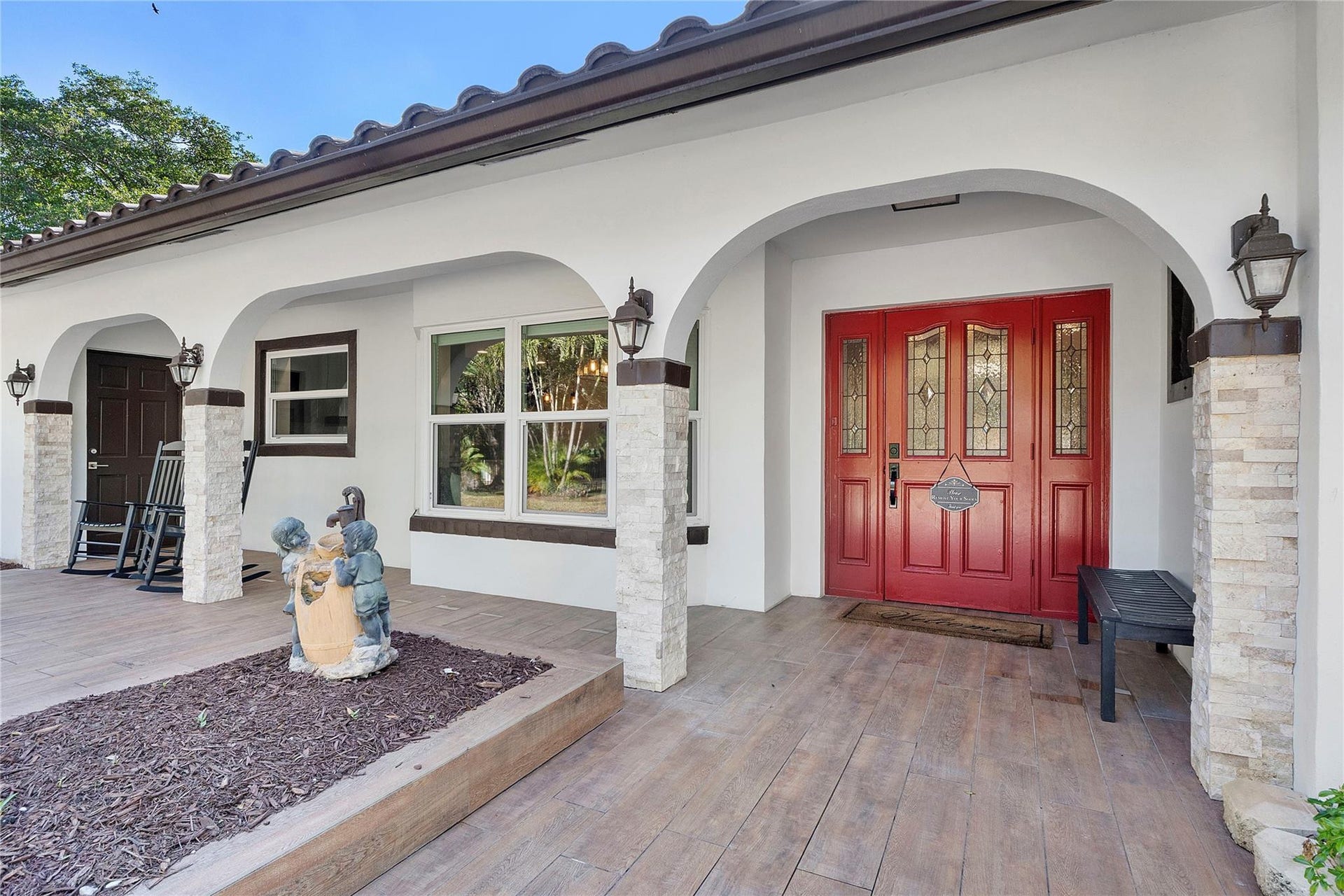 5351 Godfrey Road, Parkland, FL 33067 The front porchway, So inviting, The front garden also has a large area that is all fenced and gated, Its fun to watch the wildlife or your kids playing, great area for a baseball pitch.