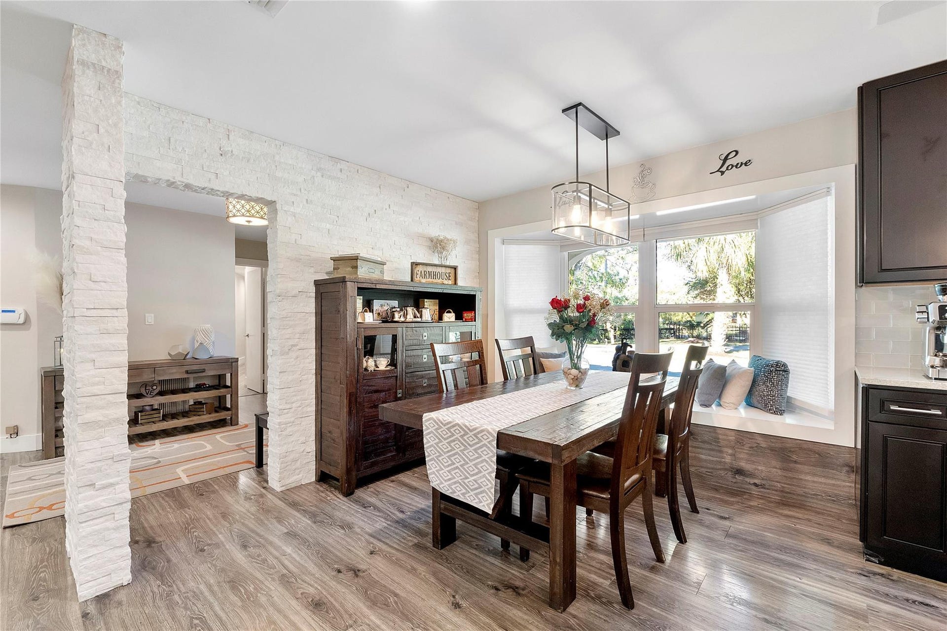 5351 Godfrey Road, Parkland, FL 33067 The main dining room that shares the open floor plan of the family room and kitchen, with such an exciting bay window with a window seat for 2, very romatic for a Valentines luncheon,