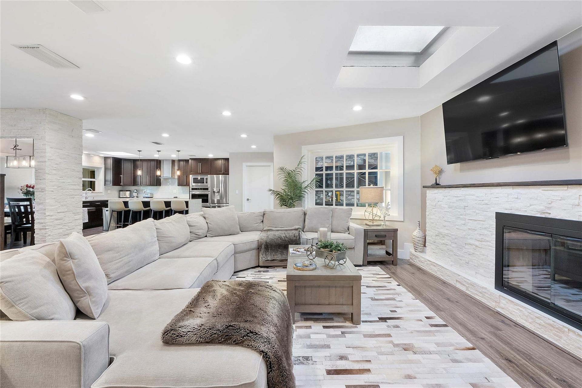 5351 Godfrey Road, Parkland, FL 33067 The family room is huge and sprawls into the kitchen & dining room and open living areas, A stone fireplace with a real living log fire and chimney