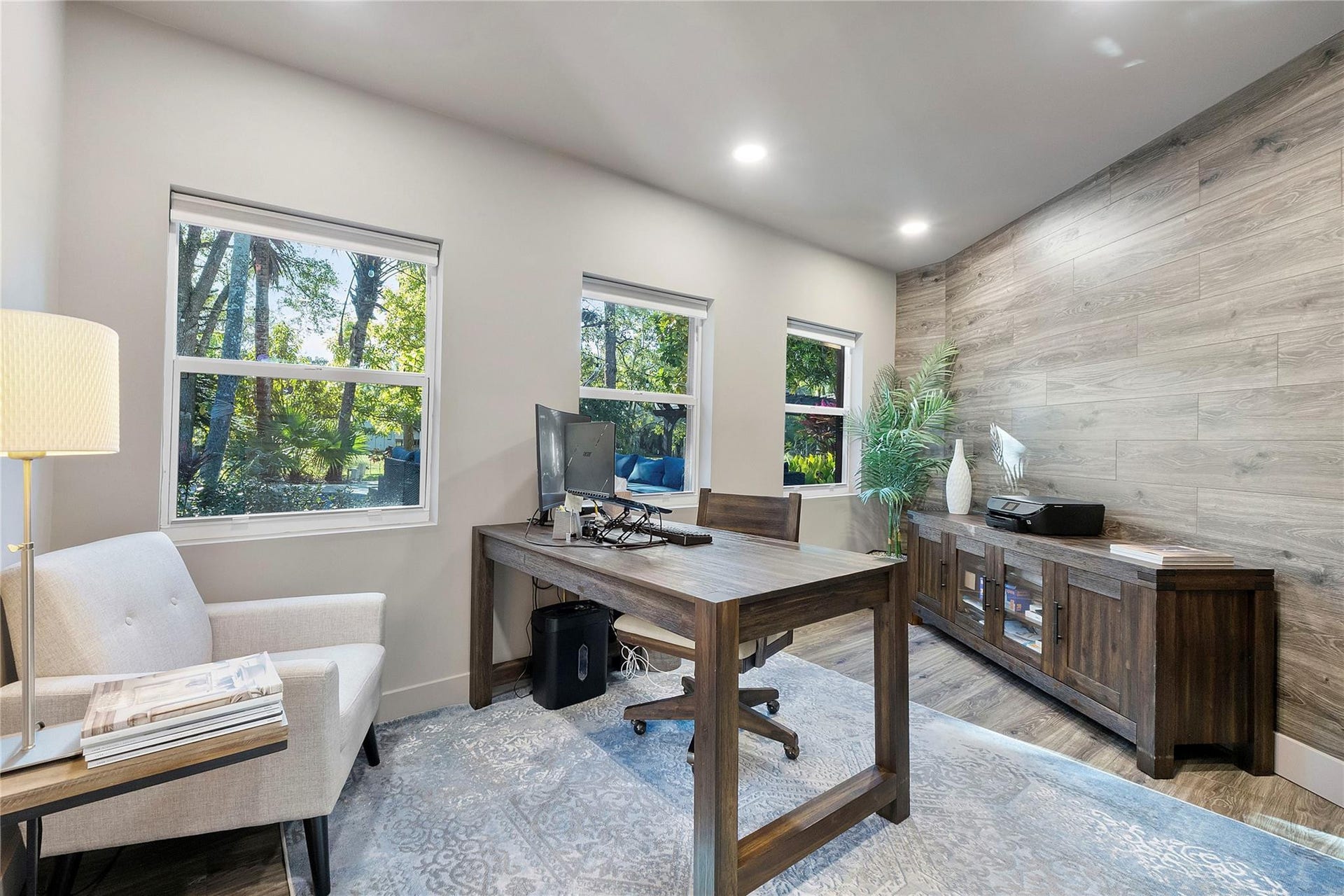 5351 Godfrey Road, Parkland, FL 33067 This private office is nestled in the back of the home with a special accent wall & LED lighting,The serene views of the pool and back garden of nature and pretty variety of birds and butterflies through your window.