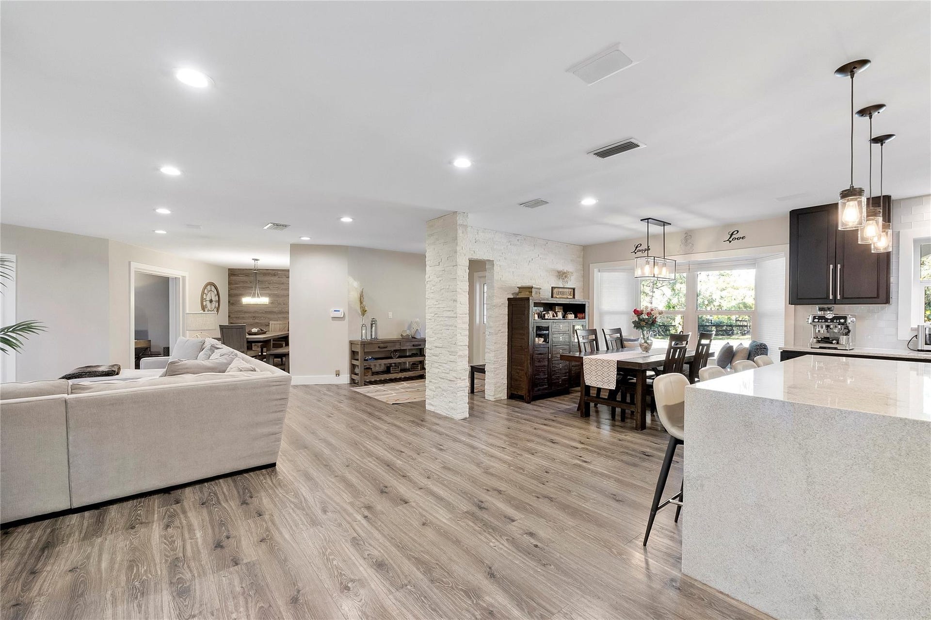 5351 Godfrey Road, Parkland, FL 33067 The spacious living room is open to the Piano room, The formal dining room, The kitchen and the casual dining room, plus the prettiest informal dining room and social room that leads to your own private office overlooking the pool & gardens