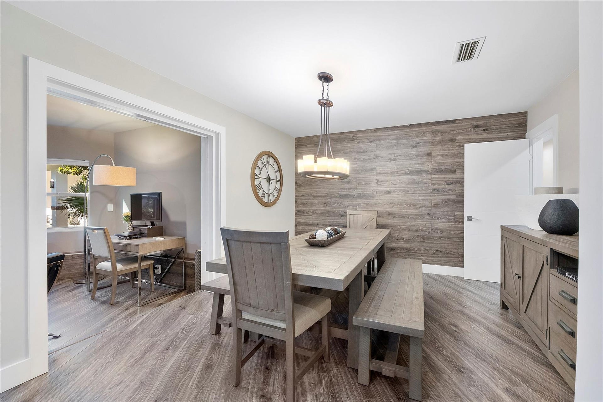 5351 Godfrey Road, Parkland, FL 33067 The Formal dining room opens up to the Piano sitting room or den,