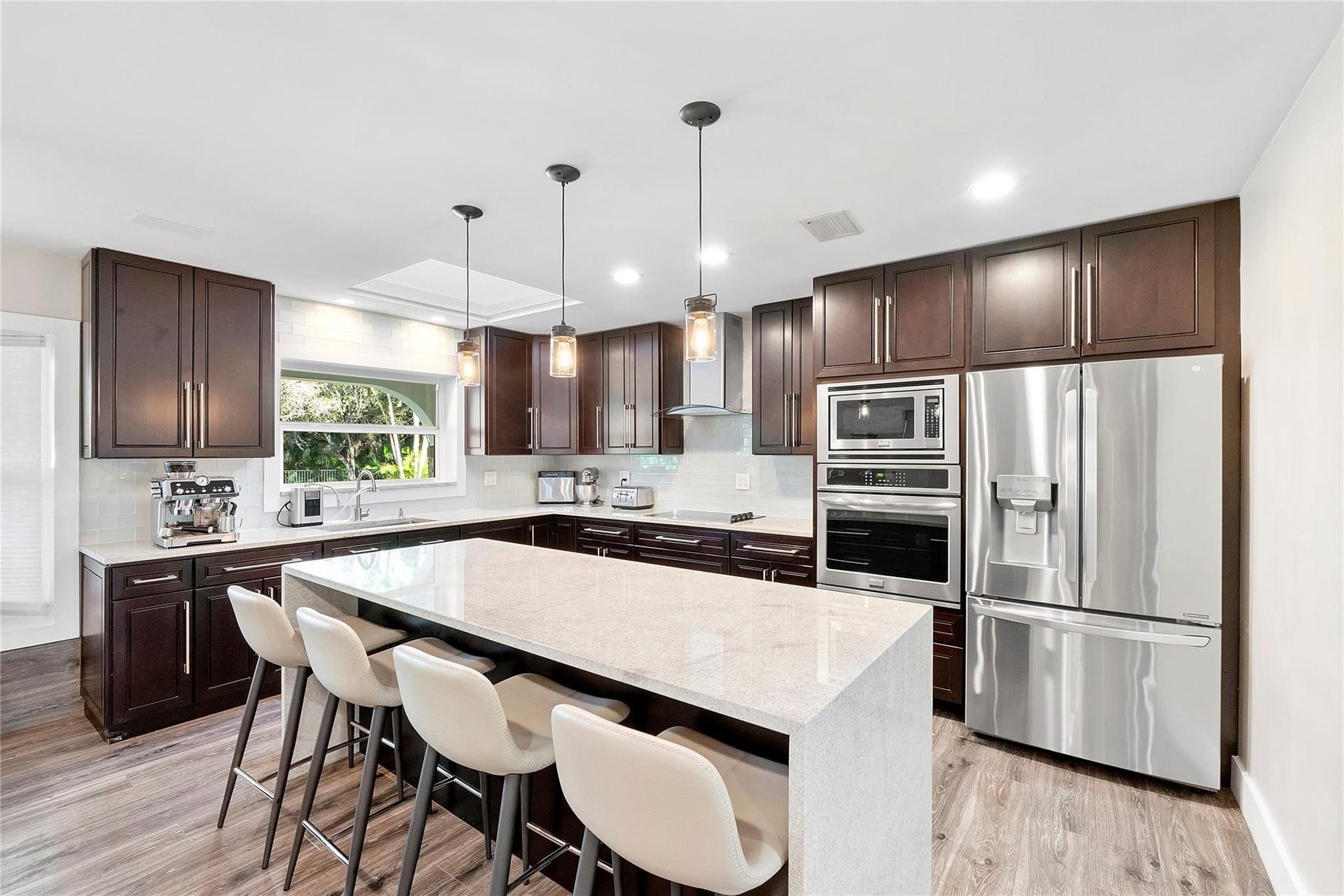 5351 Godfrey Road, Parkland, FL 33067 Beautiful granite countertops with a waterfall drop that look like Quartz and last a lot longer,