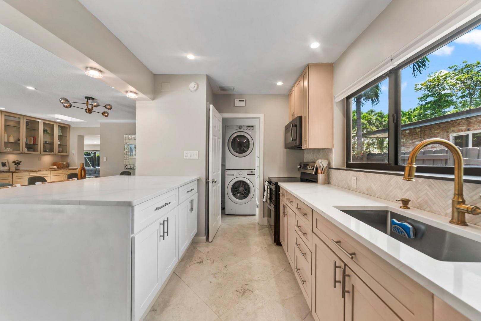 1908 NE 27th Street, Wilton Manors, FL 33306 Laundry room beyond the kitchen....