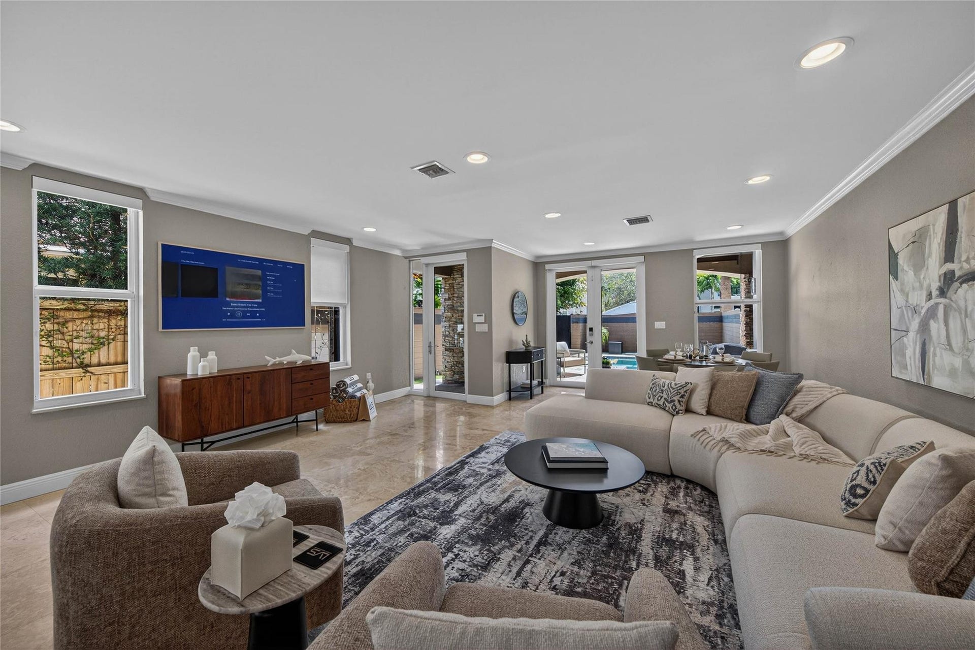 1215 NE 1st Street, Fort Lauderdale, Fort Lauderdale, FL 33301 Open layout living room with additional card or dining table overlooking pool area.
