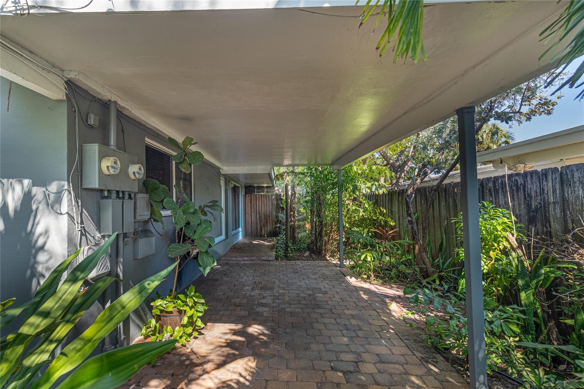 Unit 1009 private yard with covered portico.