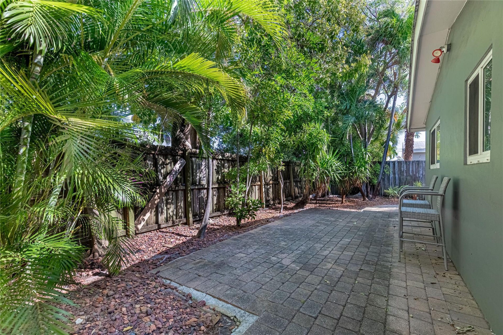 Back yard of unit 1013. This is a complete wrap around from the unit beginning along the west side where the entry door is to the east side where the private patio off the unit is located.