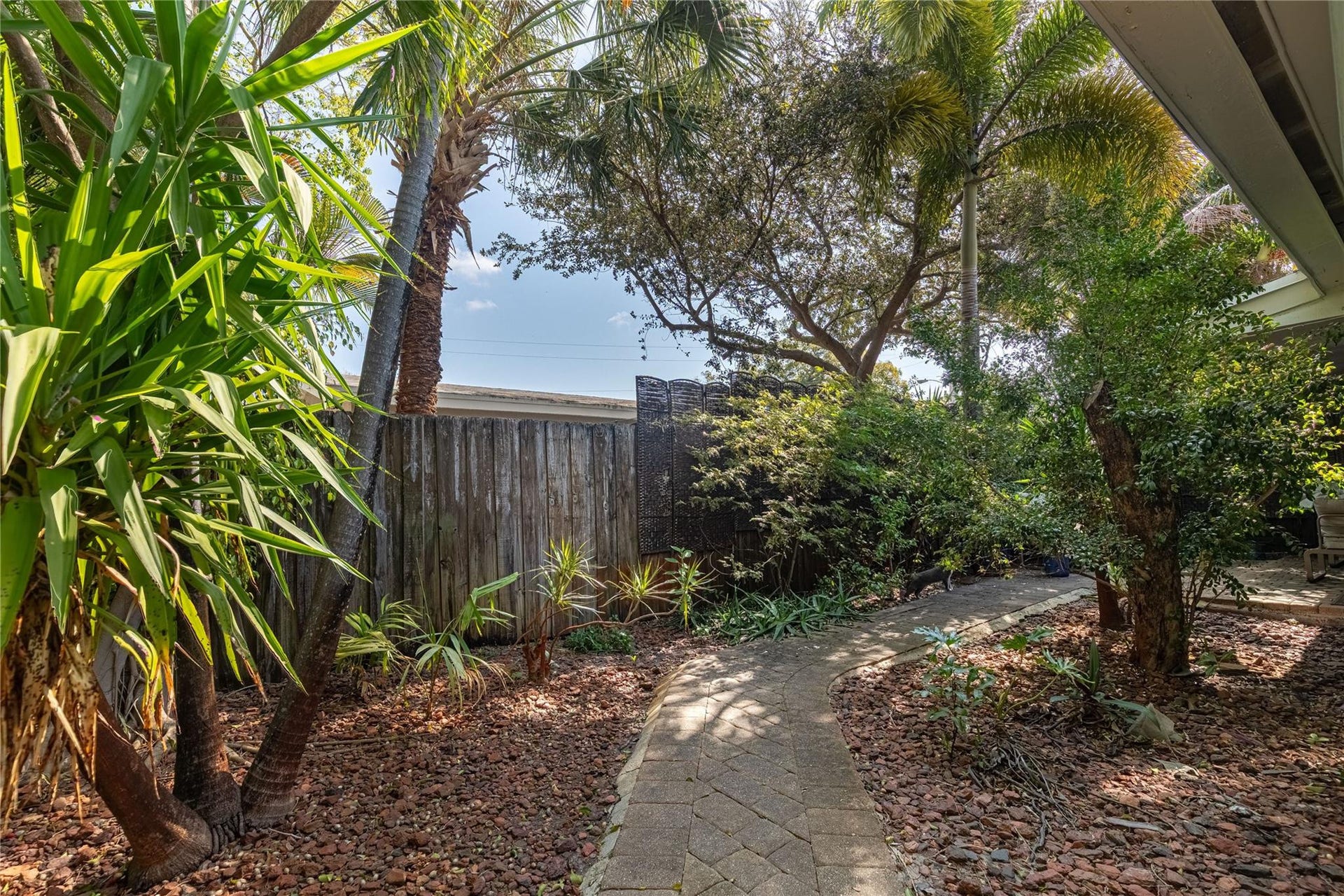 Wrap around walkway for unit 1013 from back of property to private patio.