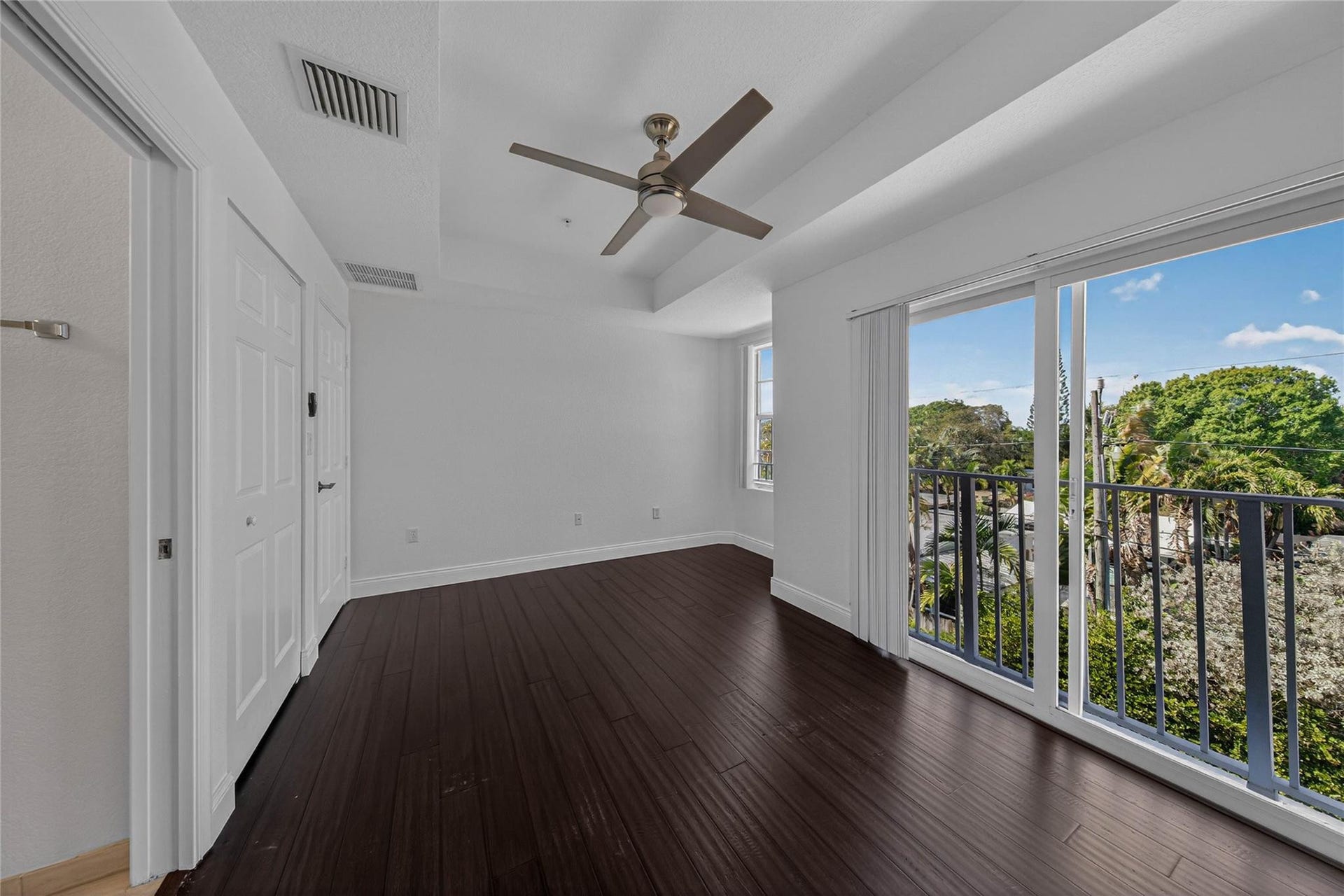 Guest bedroom with tray ceilings.