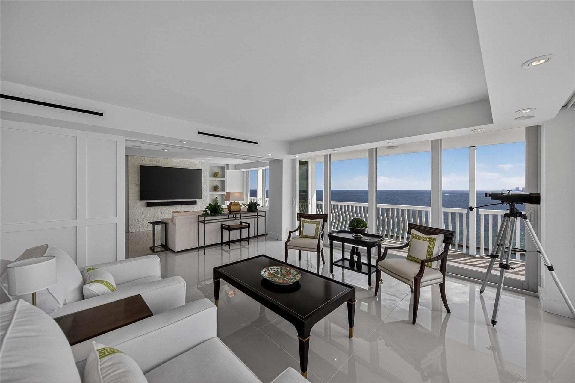 Living Room with Sliding Wall System To Den Opened