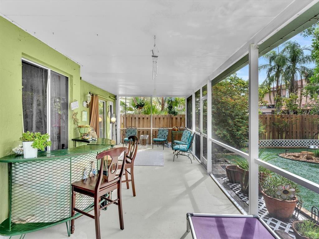 11240 Reveille Road, Cooper City, FL 33026 2nd door from the open patio on the other side. There are 2 doors.