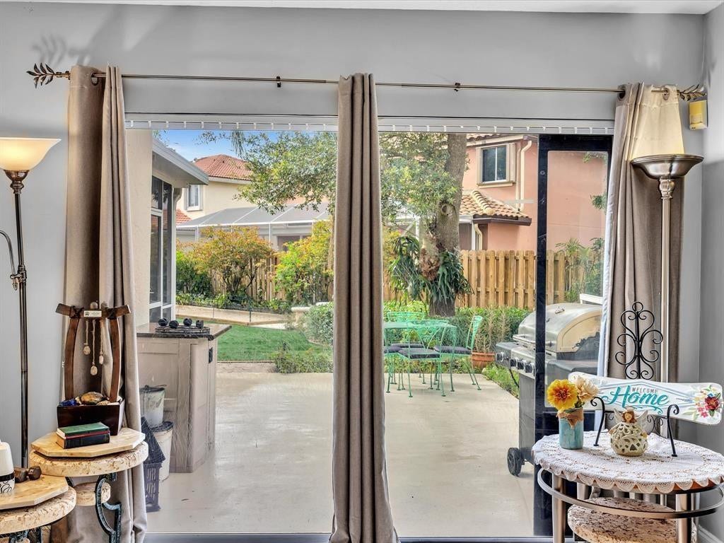 11240 Reveille Road, Cooper City, FL 33026 Sliding glass doors in living room out to open patio