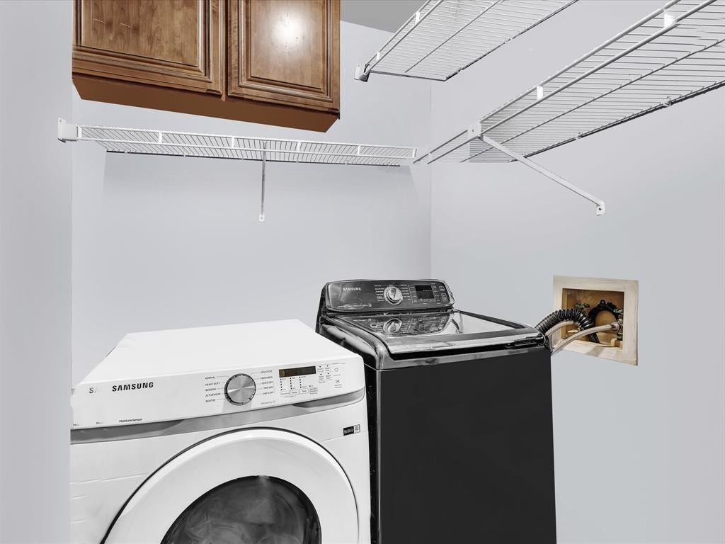 11240 Reveille Road, Cooper City, FL 33026 Laundry room has 3 shelves and a cabinet. Lot's of room for storage.