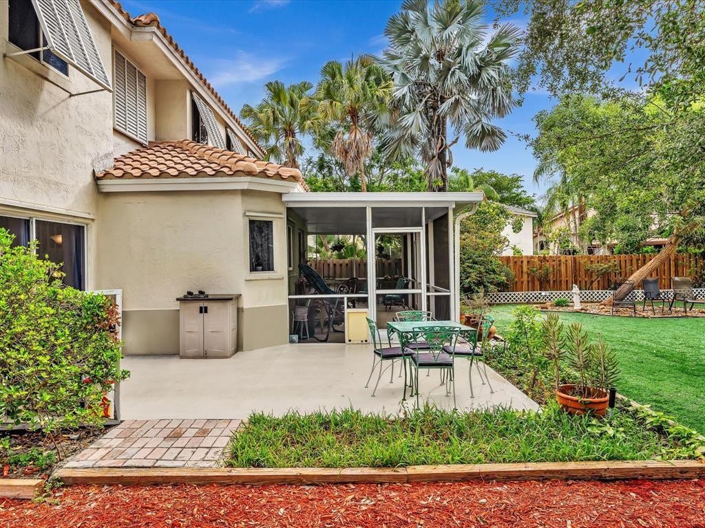 11240 Reveille Road, Cooper City, FL 33026 Open patio and screened roofed patio.