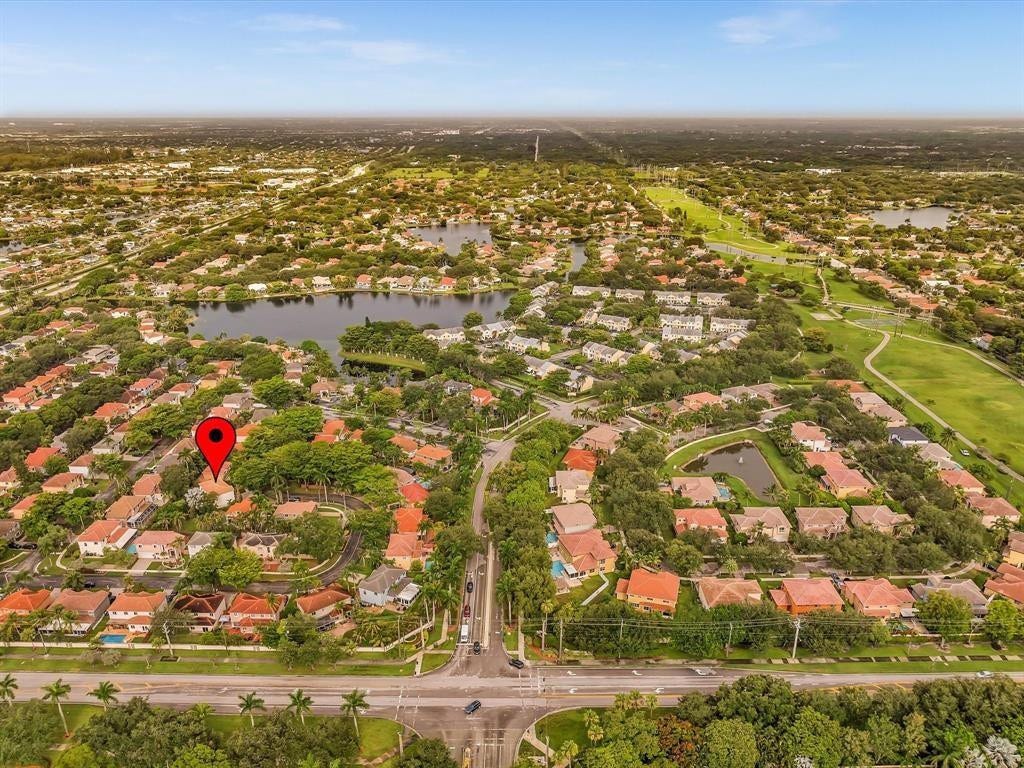 11240 Reveille Road, Cooper City, FL 33026 Red arrow is the home