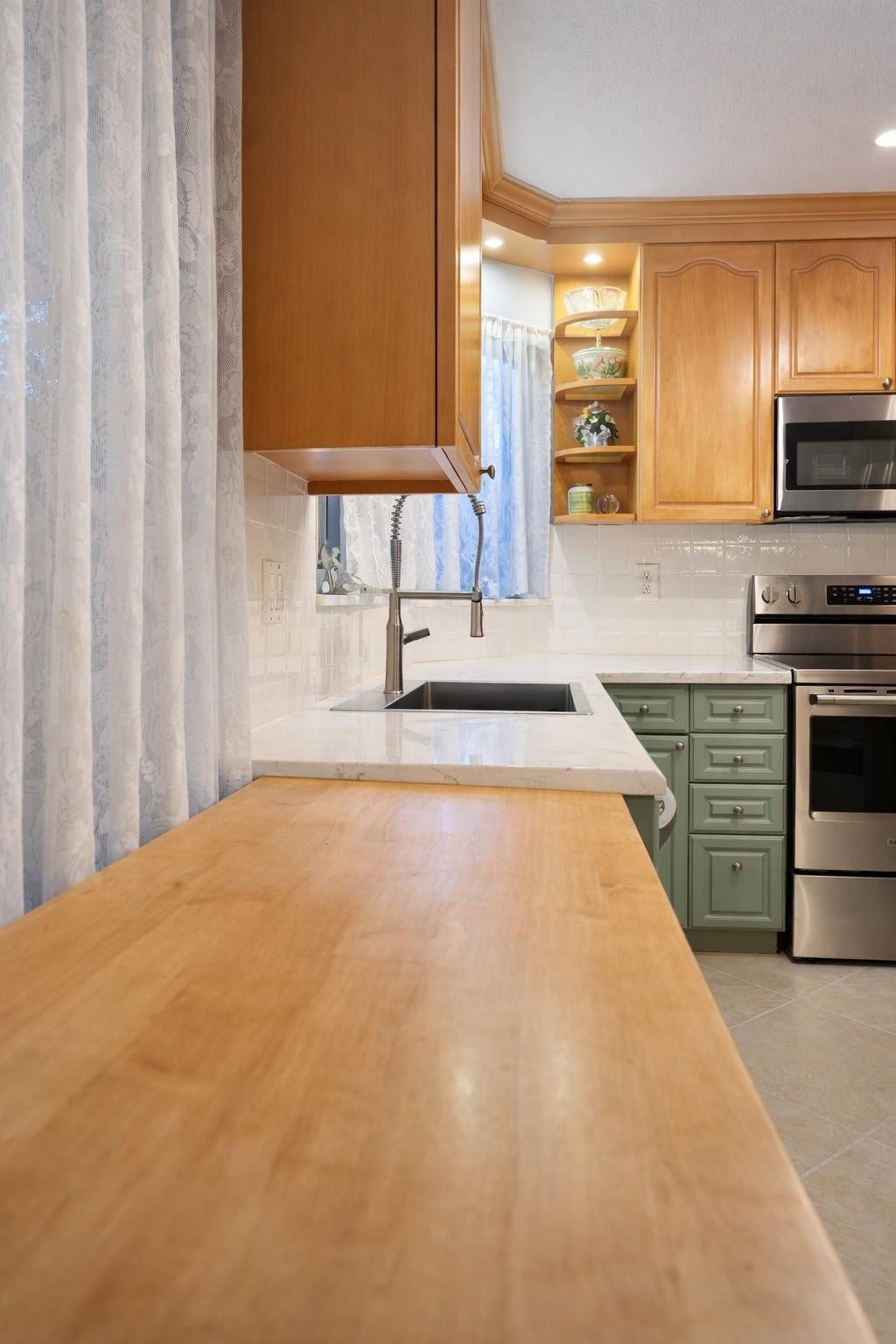 11240 Reveille Road, Cooper City, FL 33026 My wooden kitchen cart is great for extra counter space and it moves around