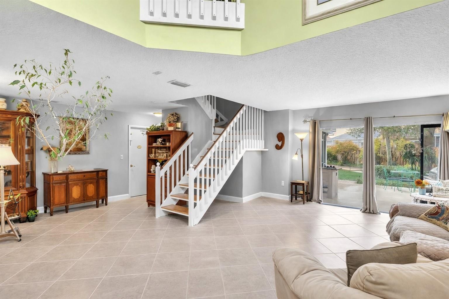 11240 Reveille Road, Cooper City, FL 33026 Large living room with sliding glass doors to open back patio.