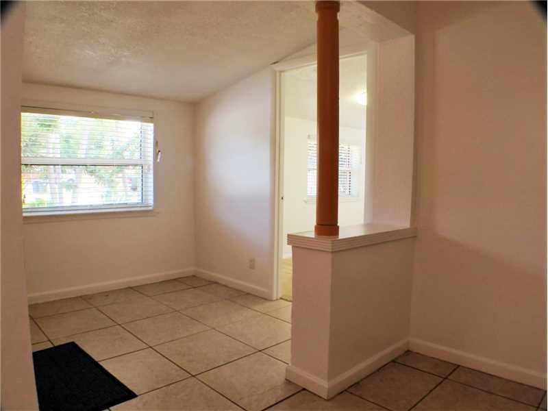 Exterior Front. Separate lobby/reception area from the front entrance, leading to office/den and to main home.