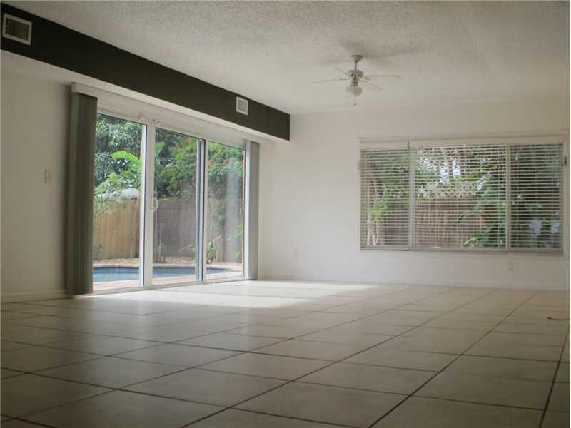 Exterior Front. Livingroom. All common ground floor area tiled in large tiles, neutral tones. All windows and patio doors are impact (2012).