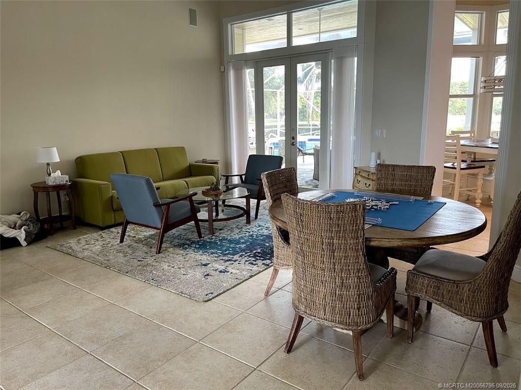 4743 SW Bermuda Way, Palm City, FL 34990 Living room looking over patio and pool