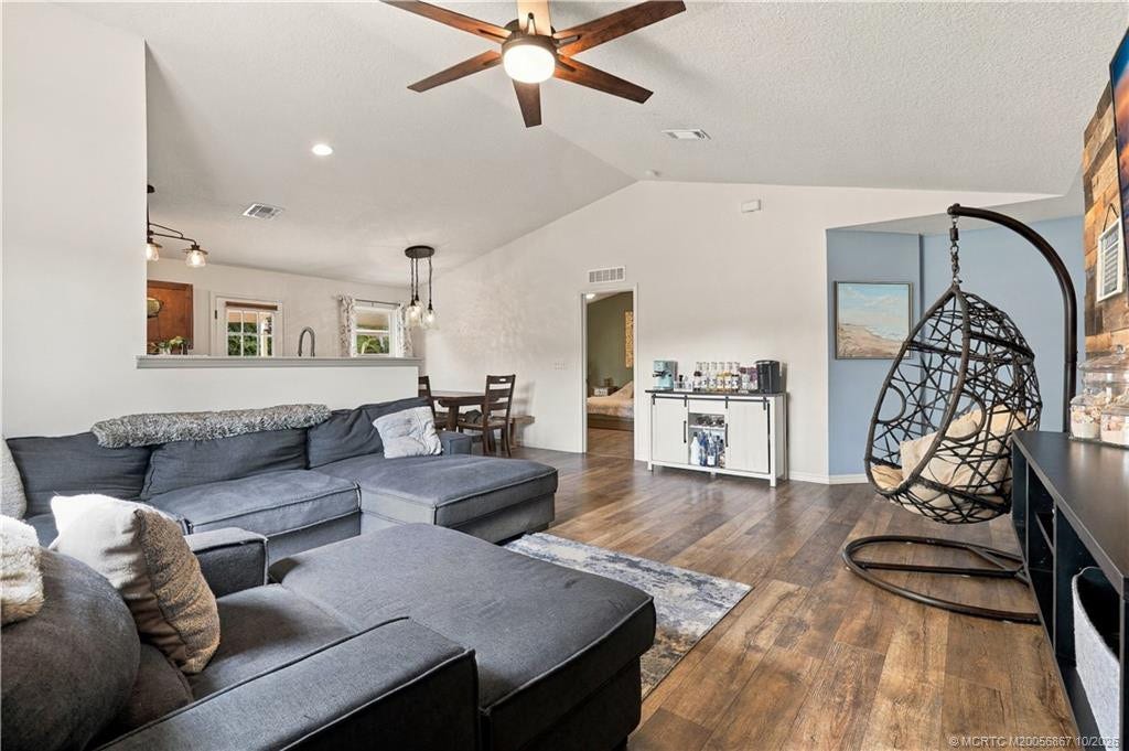 2134 SE Gaslight Street, Port St Lucie, FL 34952 Living room with open-concept sightline to kitchen