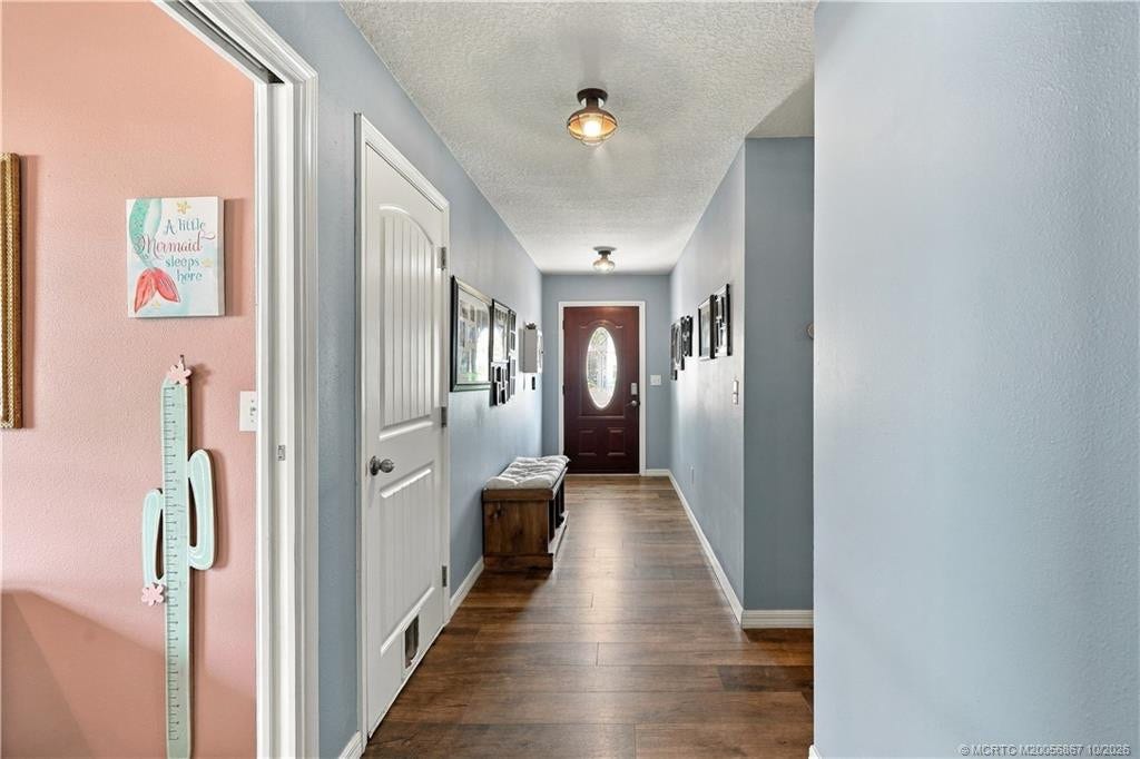 2134 SE Gaslight Street, Port St Lucie, FL 34952 Interior hallway connecting bedroom wing