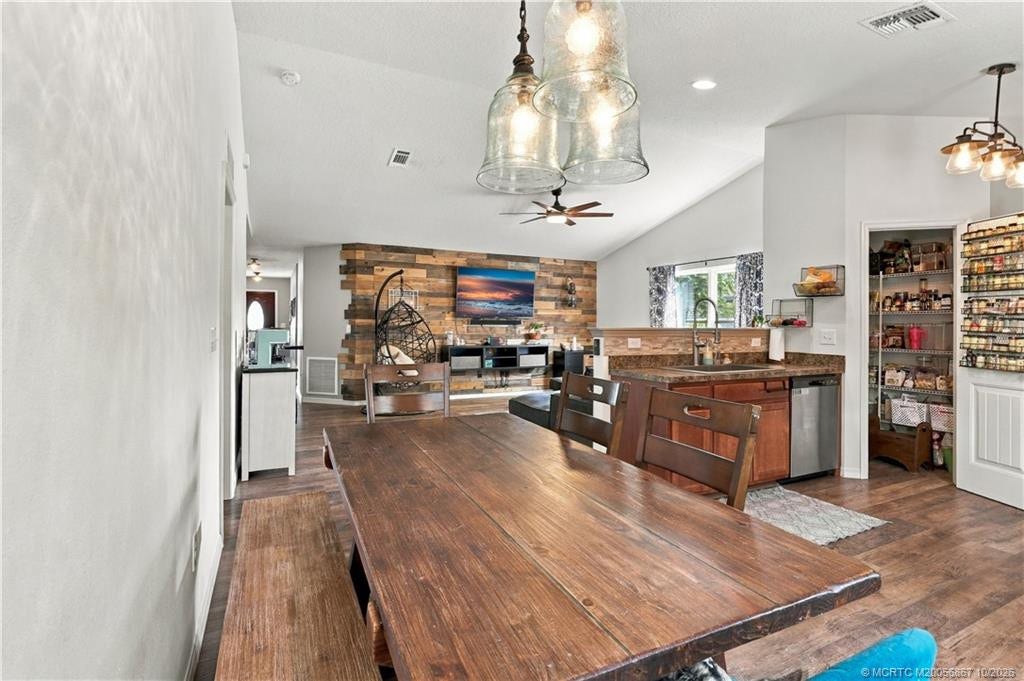 2134 SE Gaslight Street, Port St Lucie, FL 34952 Dining space with table seating and pendant lighting