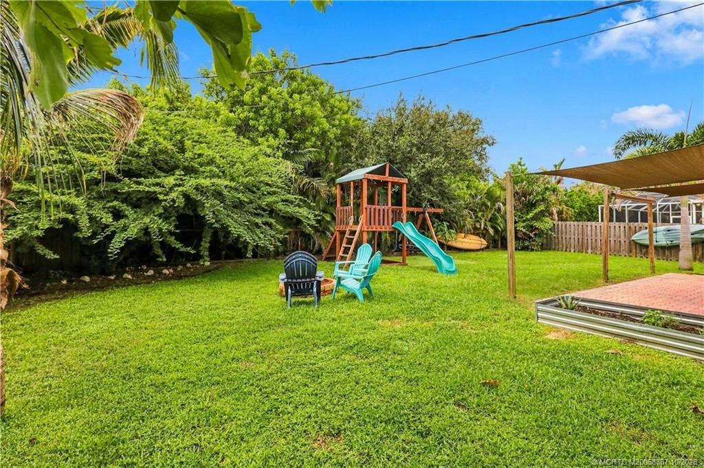 2134 SE Gaslight Street, Port St Lucie, FL 34952 Additional backyard lawn view