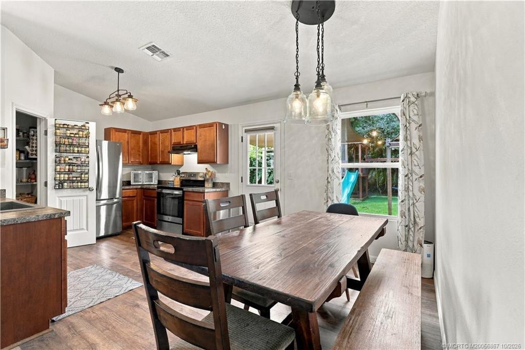 2134 SE Gaslight Street, Port St Lucie, FL 34952 Dining space with table seating and pendant lighting