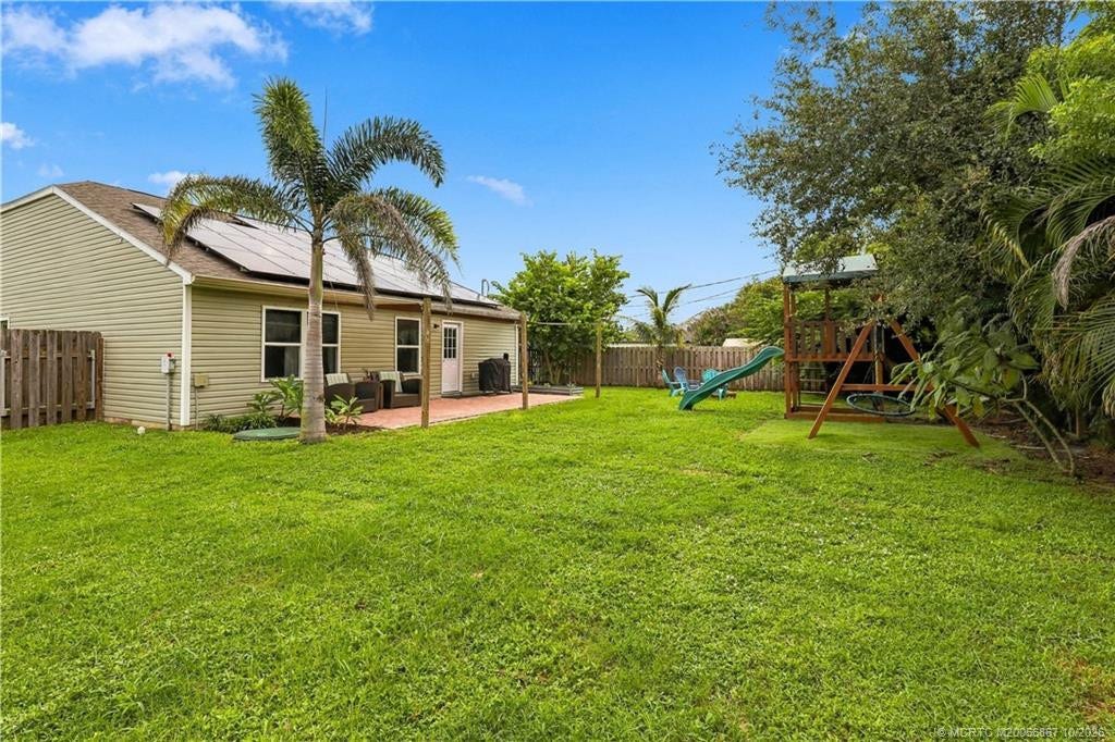 2134 SE Gaslight Street, Port St Lucie, FL 34952 Additional backyard lawn view