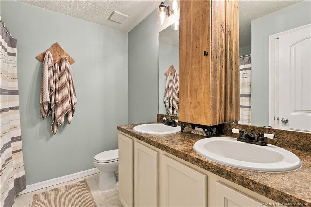 2134 SE Gaslight Street, Port St Lucie, FL 34952 Primary bath with dual-sink vanity