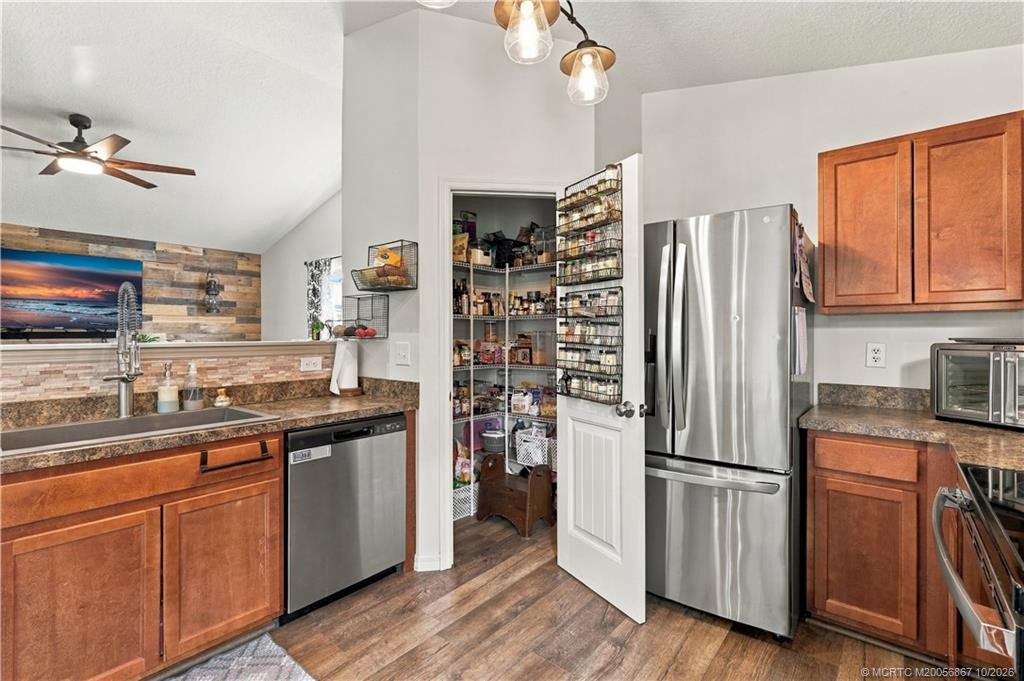 2134 SE Gaslight Street, Port St Lucie, FL 34952 Large Walk-In Pantry Kitchen with stainless refrigerator and ample cabinet storage