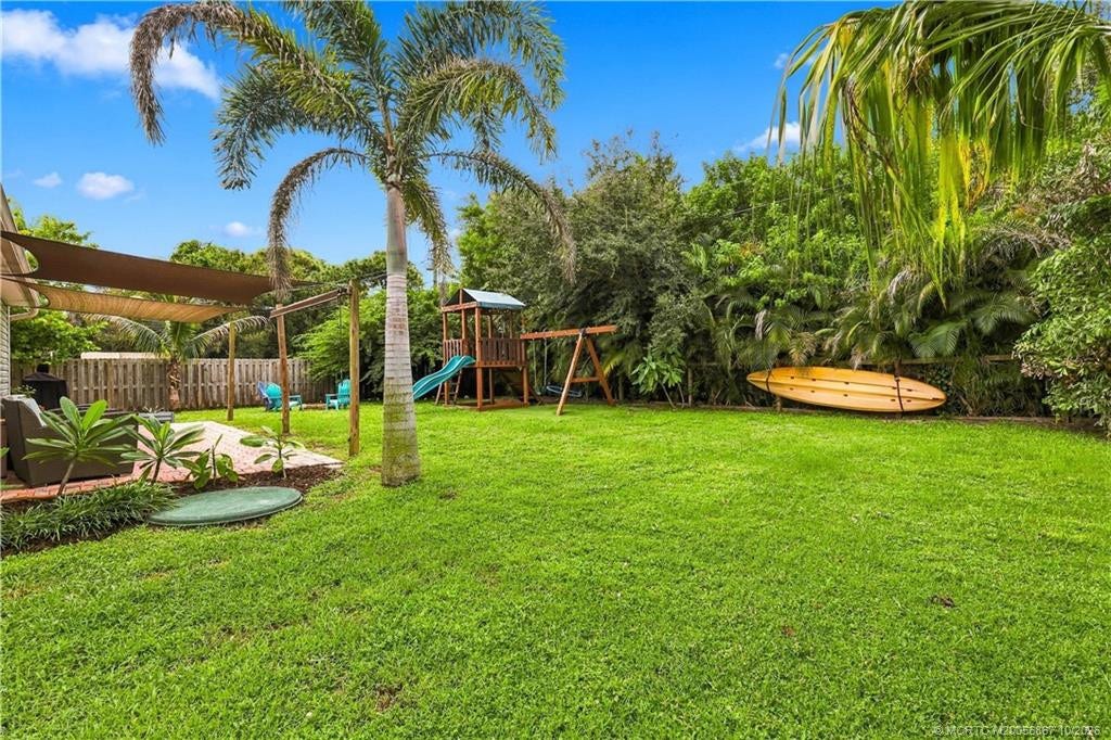 2134 SE Gaslight Street, Port St Lucie, FL 34952 Additional backyard lawn view