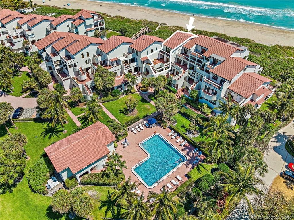 Aerial view identifies the residence within The Dune, with the community pool and Atlantic Ocean just steps away.