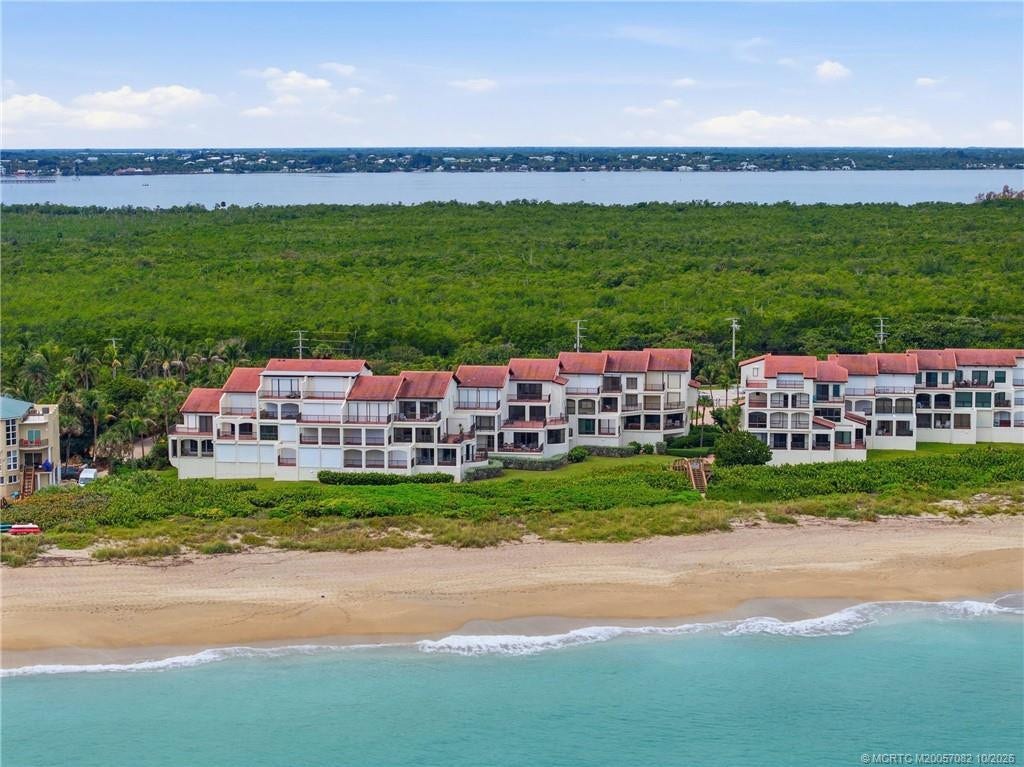 Stunning aerial view of The Dune along the Atlantic shoreline, surrounded by natural coastal landscape with the Indian River beyond.