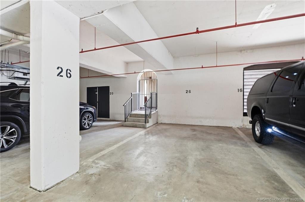 Dedicated covered garage parking space #26.