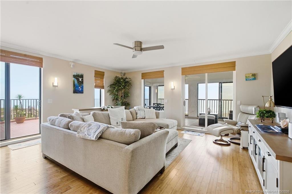 Multiple glass doors bring the ocean views into the living room and provide access to the outdoor living spaces.