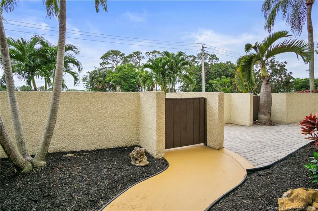 1800 SE Saint Lucie Boulevard, #9-105, Stuart, FL 34996 walk way on paved patio