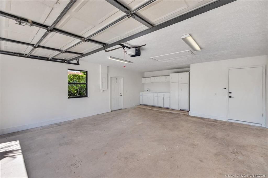 2118 NE Ginger Terrace, Jensen Beach, FL 34957 Garage with extra space for workshop