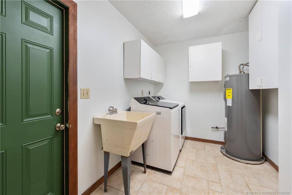 5820 SW Grove Street, Palm City, FL 34990 Laundry room just off kitchen with entrance from carport area.