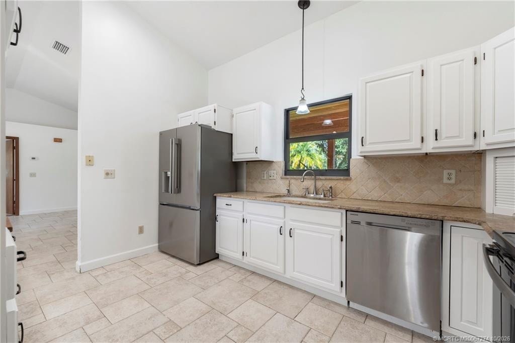 5820 SW Grove Street, Palm City, FL 34990 Stainless steel appliances in kitchen.